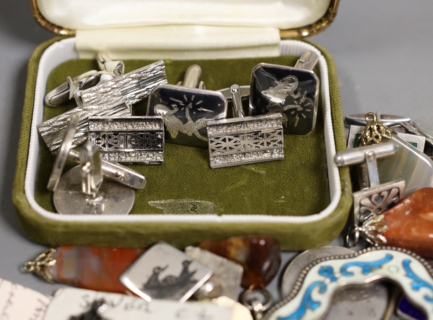 A group of mixed items including quartz pendants, a sterling and enamel brooch, 68mm, assorted pairs of cufflinks, medallions and four pens including Sampson Mordan, hallmarked for London, 1932.